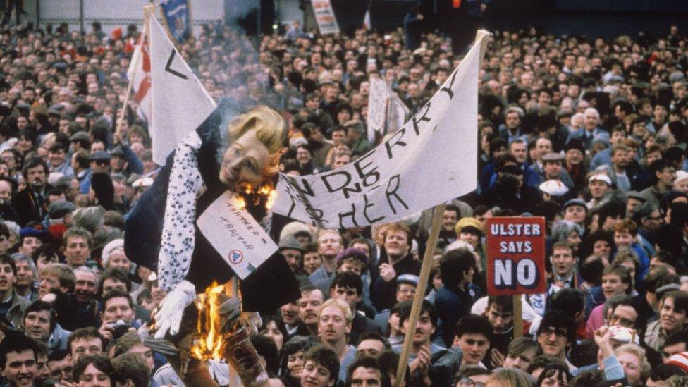 An effigy of Margaret Thatcher is burned at a rally opposing the Anglo-Irish Agreement