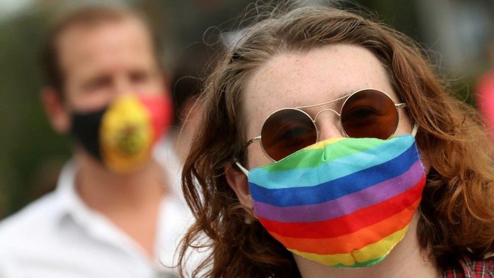 People gather outside the European Union institutions to rally in solidarity with Poland's LGBT community in Brussels