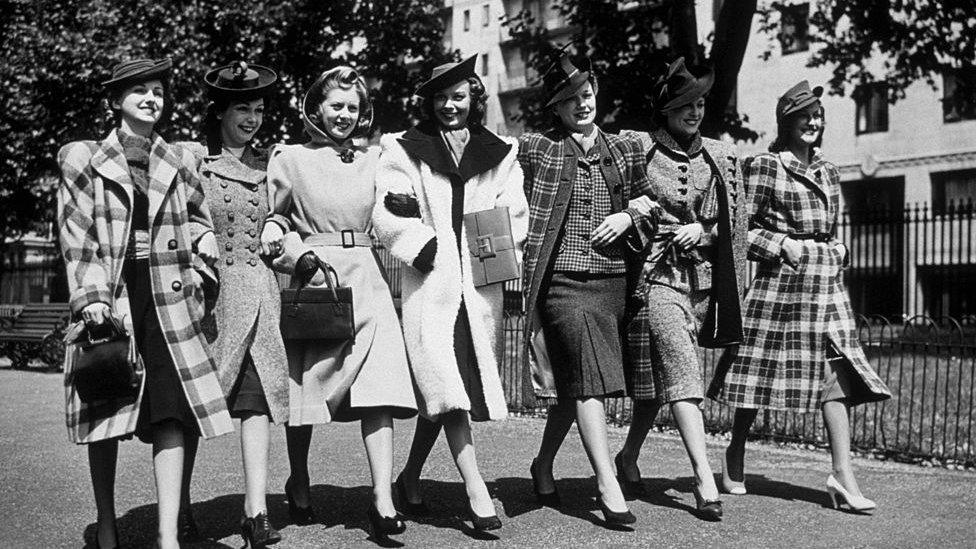 Women walking arm in arm in the 40s