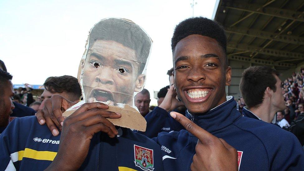 Ivan Toney with a cardboard cut out Ivan Toney from his days as a Northampton Town player in 2014