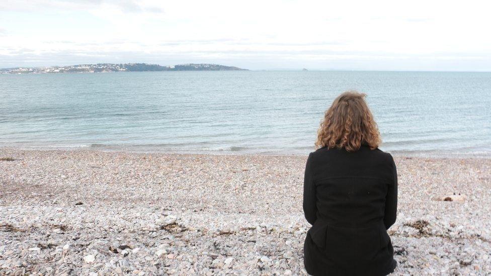 Gabbi sat on the beach