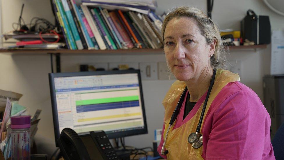 Dr Rachel Warrington at her desk