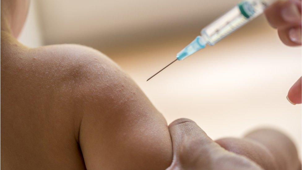 child being immunised