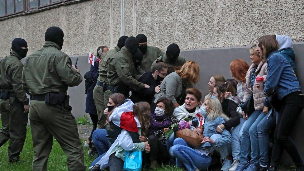 Women are detained during a march in support of Maria Kolesnikova and other opposition leaders