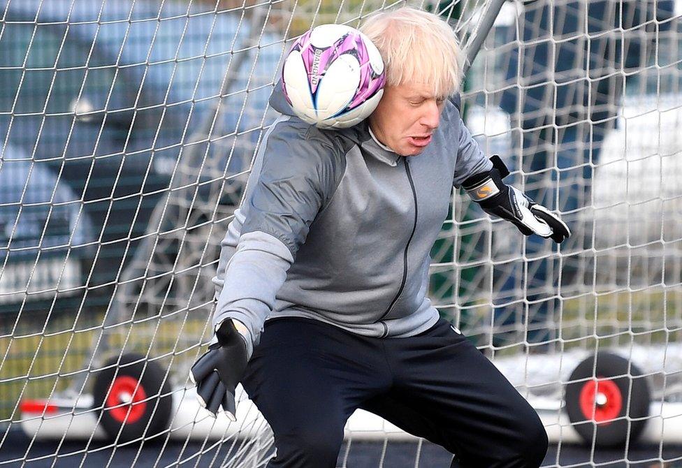 Prime Minister Boris Johnson tried to save a shot whilst in a football goal