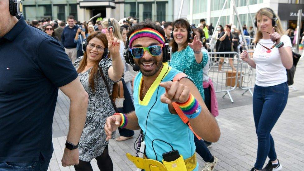 People enjoying a silent disco with headphones on