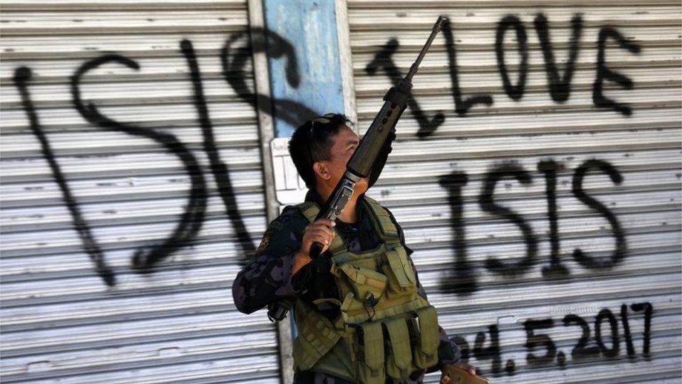 A Filipino government troop conducts patrol on a reclaimed former Maute stronghold in Marawi City, Mindanao Island, southern Philippines, 30 May 2017, as fighting between Islamist militants and government forces continues