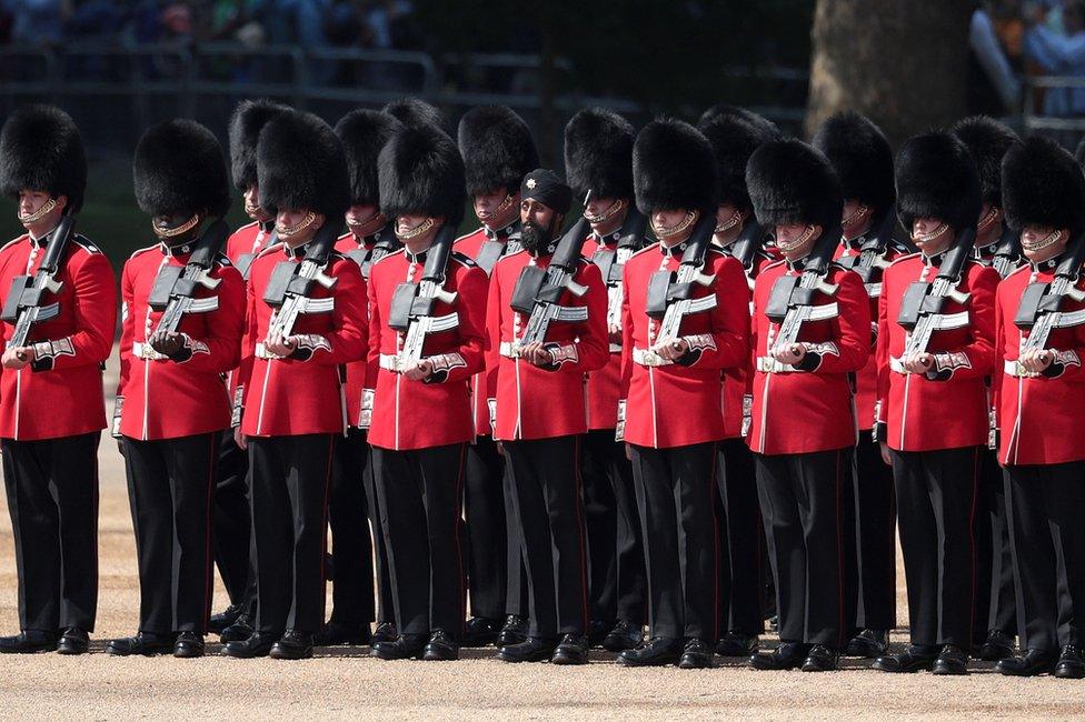 Coldstream Guards soldier Charanpreet Singh Lall marches during Trooping The Colour parade on 9 June