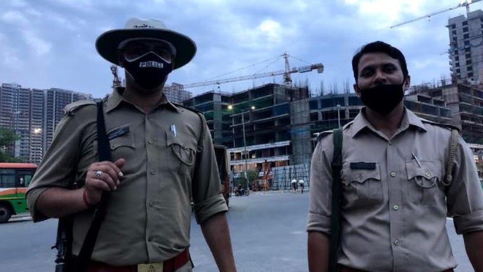 Police standing outside a building