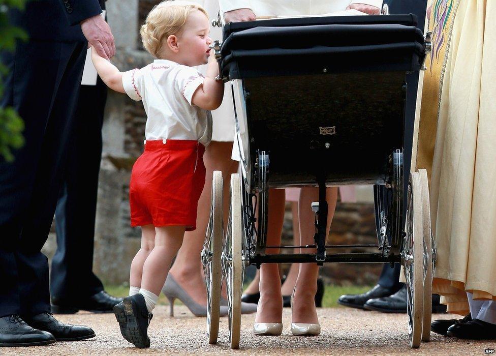 Prince George taking a cheeky peek at his sister, Princess Charlotte in her pram on the way you to her christening.