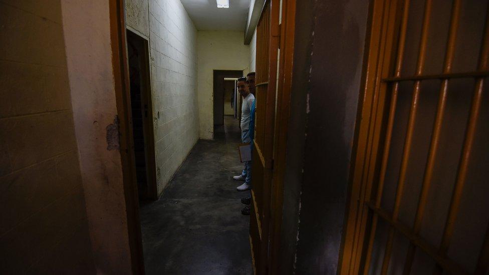 Inmates are seen in a sector of the El Rodeo prison where a new penitentiary system is being implemented and prisoners with good conduct receive military training, in Guatire, 20km from Caracas, on July 1, 2016.