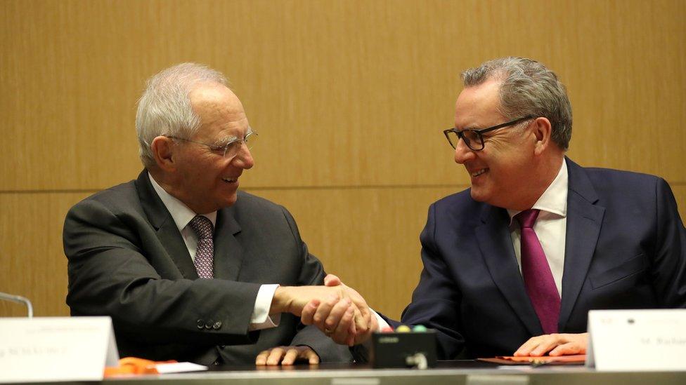 President of the French National Assembly Richard Ferrand (R) and Germany"s Bundestag president Wolfgang Schauble shake hands after signing during the launching of the French-German Parliamentary Assembly on March 25, 2019 at the French National Assembly in Paris.