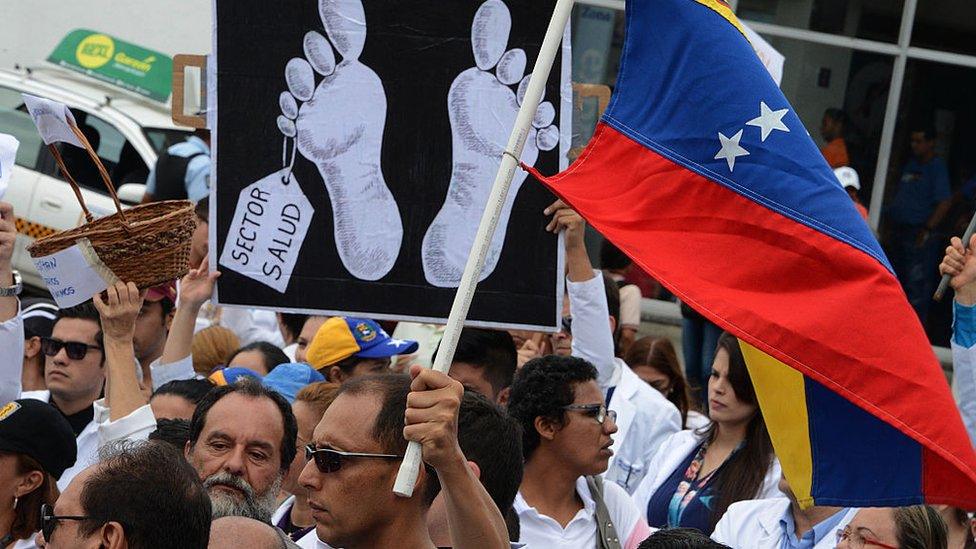 A protest banner declares the health sector dead