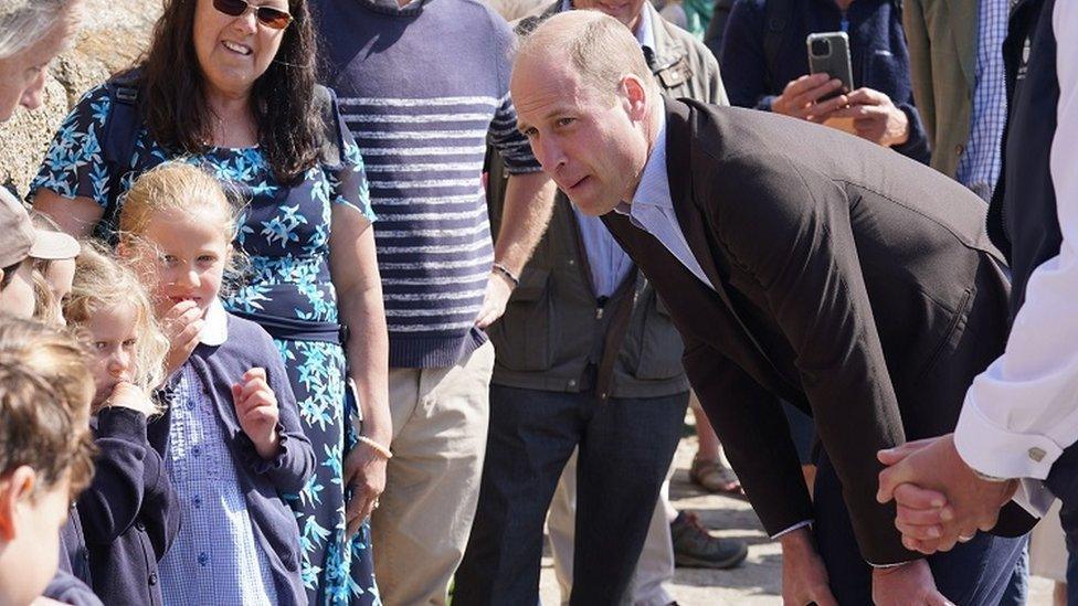 William meets schoolchildren during a visit to St Mary's Harbour