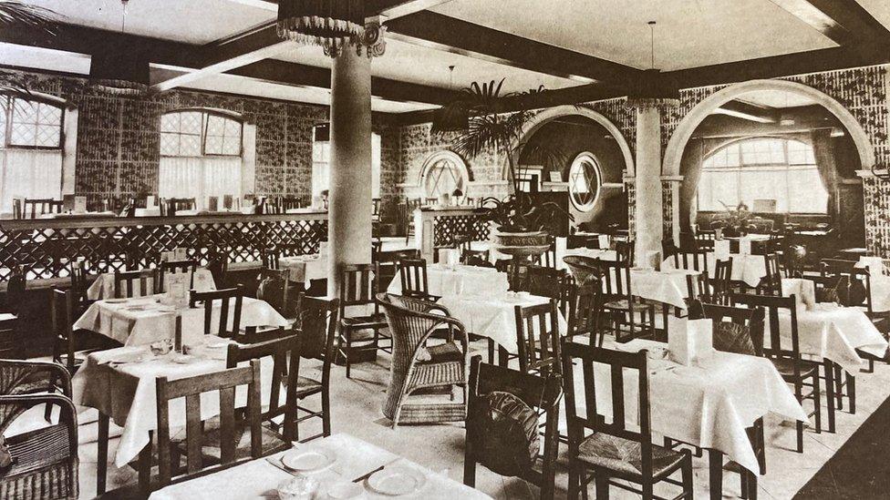 Table and chairs in ornate tearoom