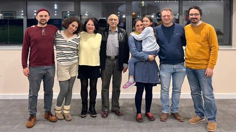 Picture taken from twitter showing Nazanin and Anoosheh Ashoori another British-Iranian who was released, standing in a group with their relatives.