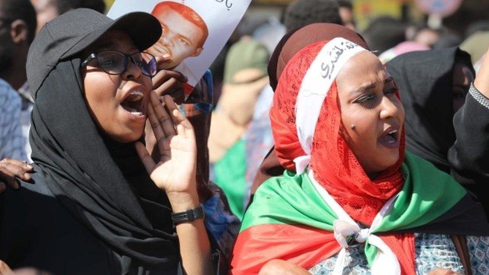 Sudanese people react as they gather in front of a court in Omdurman, near the capital Khartoum, Sudan, 30 December 2019, during the trial of a group of intelligence agents who are accused of the death of a school teacher while in custody