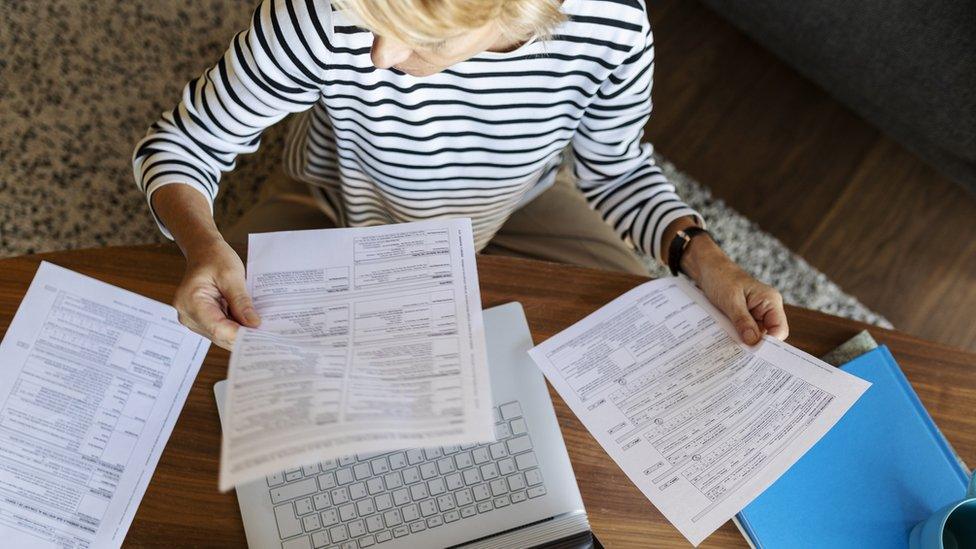 business woman paying bills