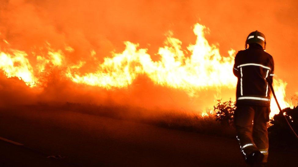 A firefighter tackles a fire in Pontefract in August 2022