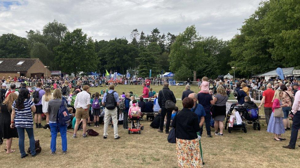 Crowds gather around one of the show rings