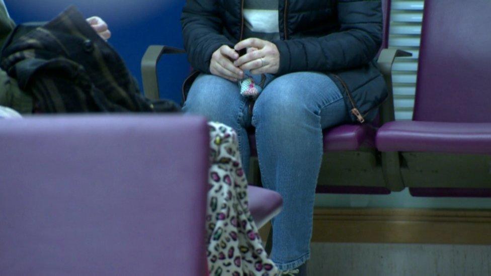 A woman in a hospital waiting room