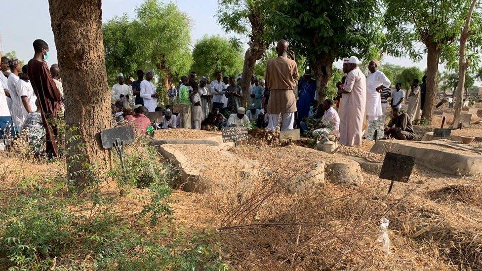 People at grave