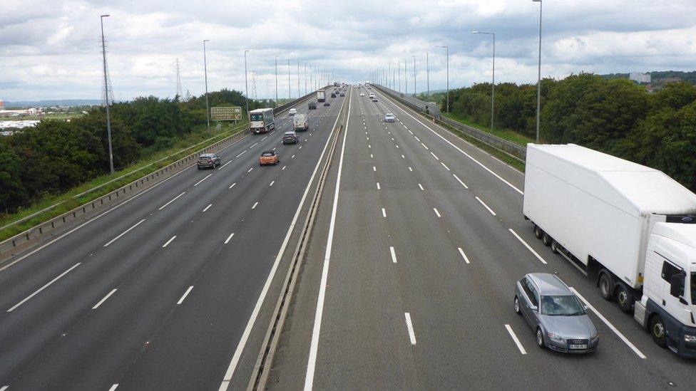 The bridge with vehicles moving over it