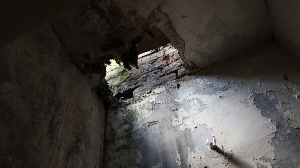 A hole in the ceiling of one of the houses on Garrick Street