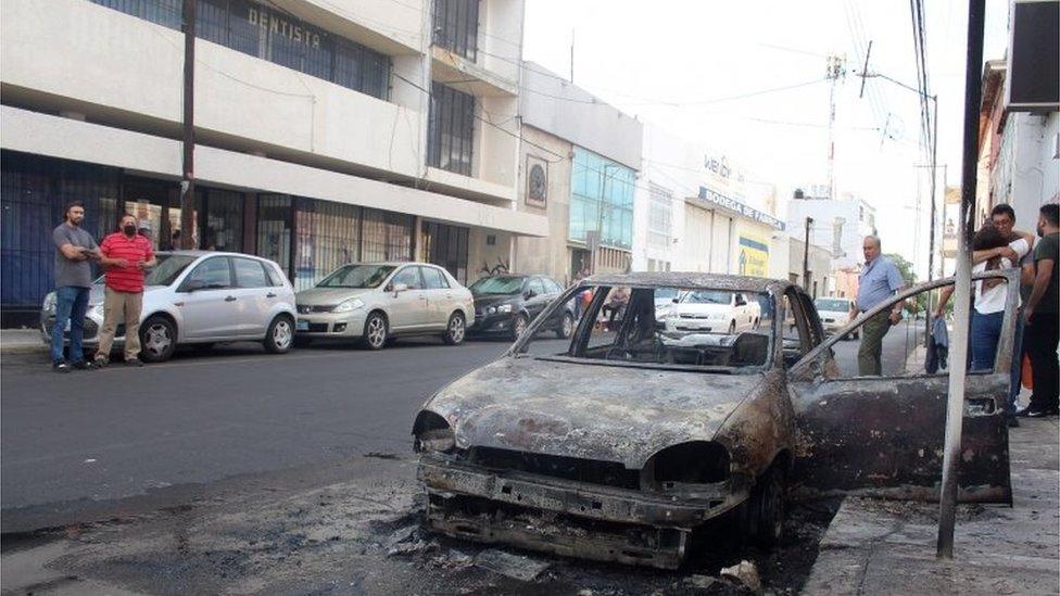 A view of a street after alleged members of criminal gangs set fire to vehicles and blocked roads in the city of Celaya, Guanajuato state, Mexico, 20 June 2020.