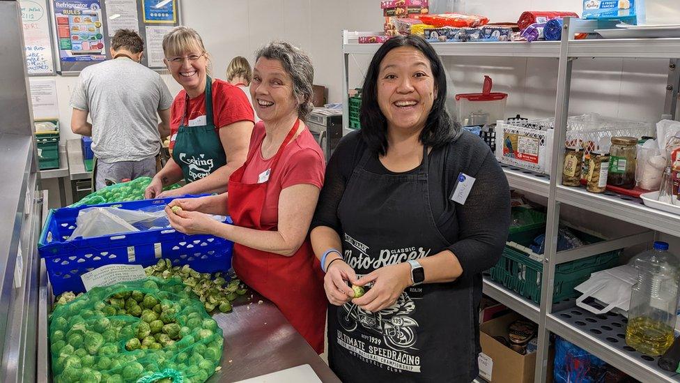 Caring in Bristol volunteers helping with the preparation and cooking of Christmas dinner for guests