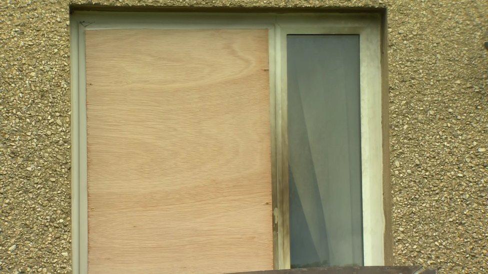 Boarded up windows in the house in Brooke Park