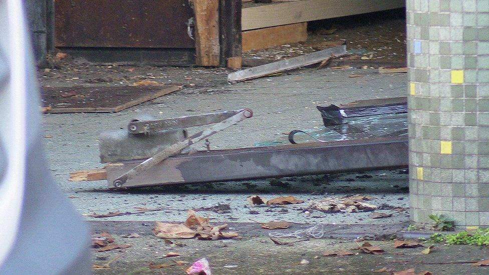 Remains of a door following the raid at a community centre in Burngreave, Sheffield