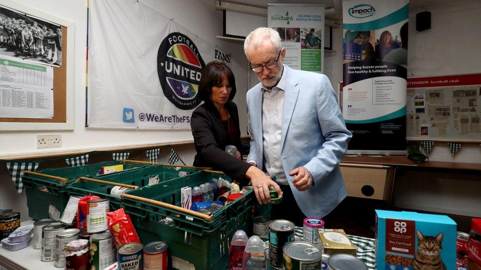 Jeremy Corbyn helps to sort out food donated to the food bank