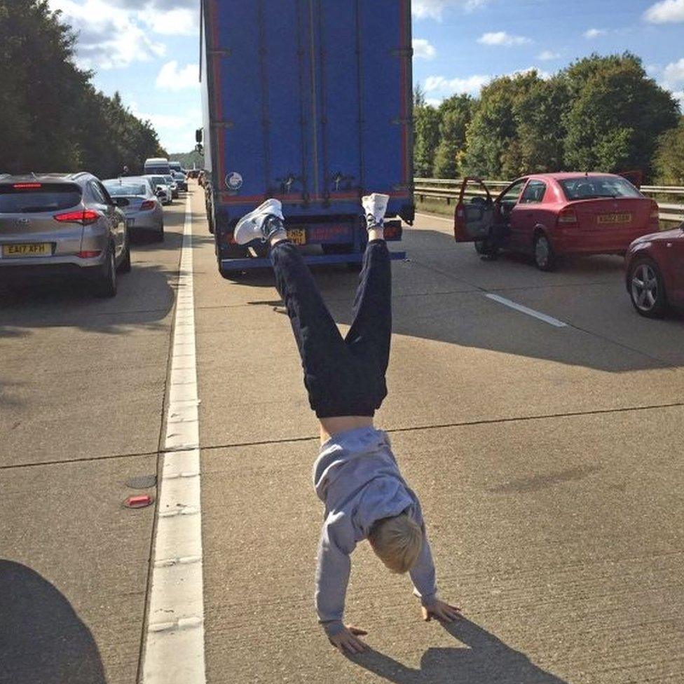 Someone doing a handstand on the M3