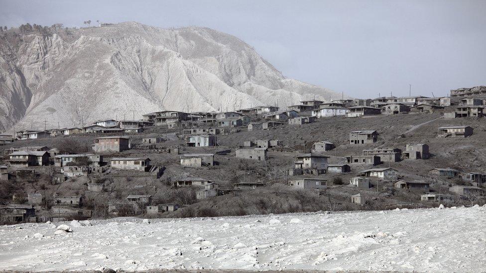 Ash-covered houses in abandoned city of Plymouth, Soufriere Hills Volcano, Montserrat