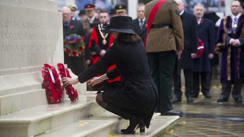 Theresa Villiers laid a wreath at the cenotaph at Belfast City Hall