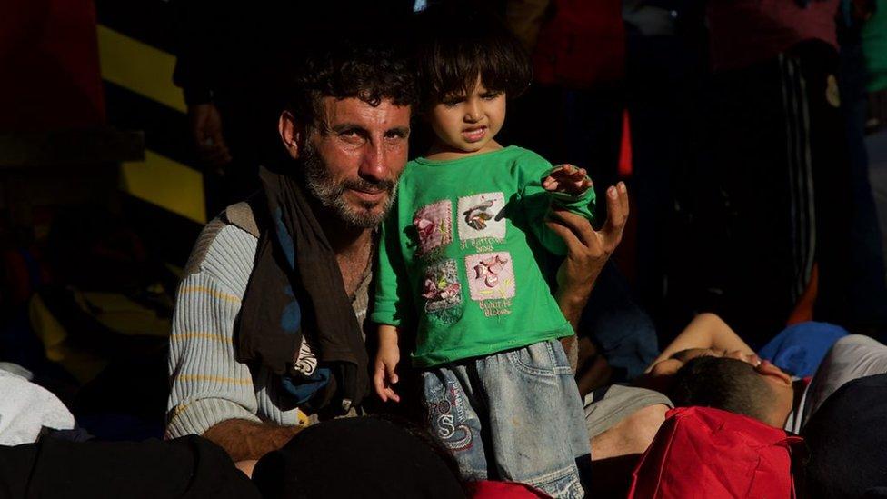 A man and his daughter after being rescued