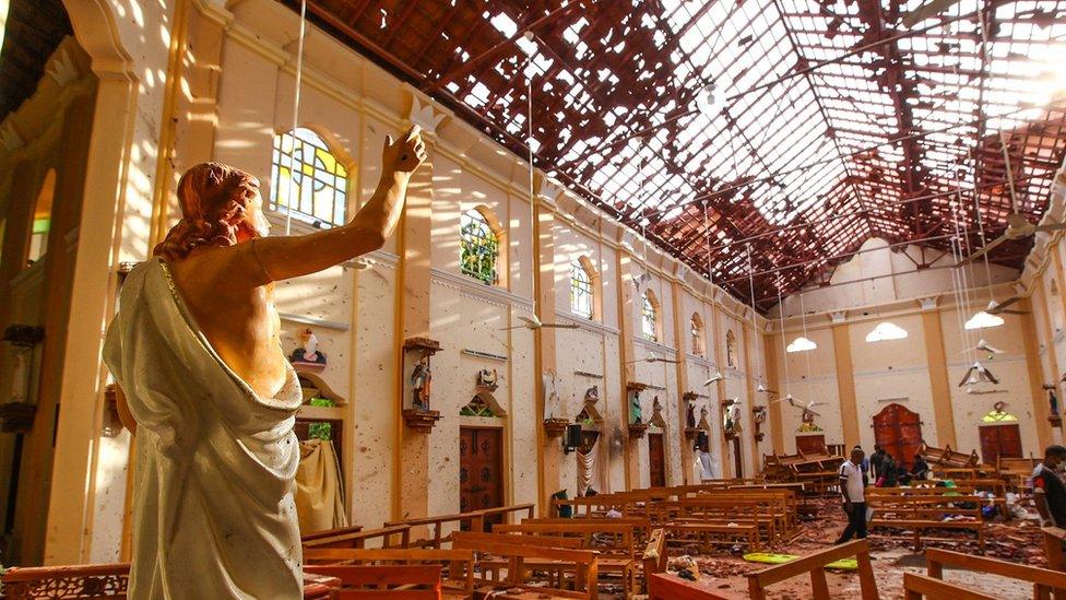 Officials inspect the damaged St. Sebastian's Church after multiple explosions targeting churches and hotels across Sri Lanka on April 21, 2019 in Negombo, north of Colombo, Sri Lanka.