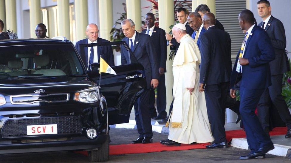 Pope going into a Kia