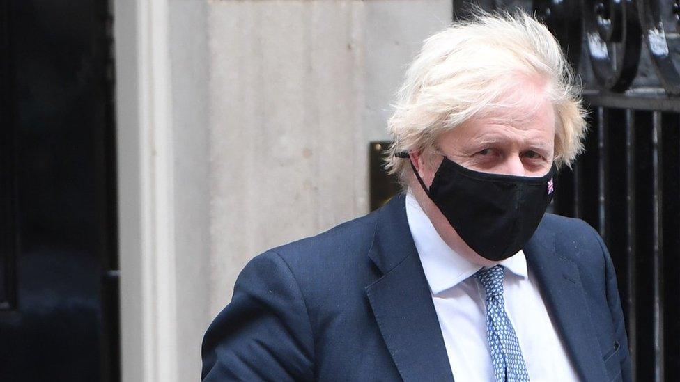 Boris Johnson wears a mask at Downing Street this week