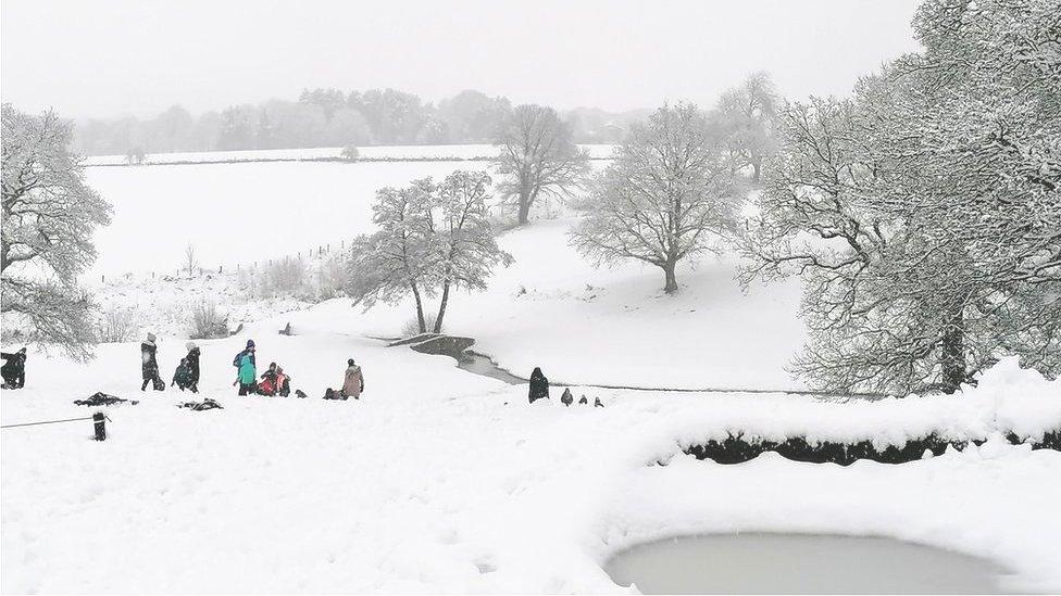 People in the snow in Adel, Leeds