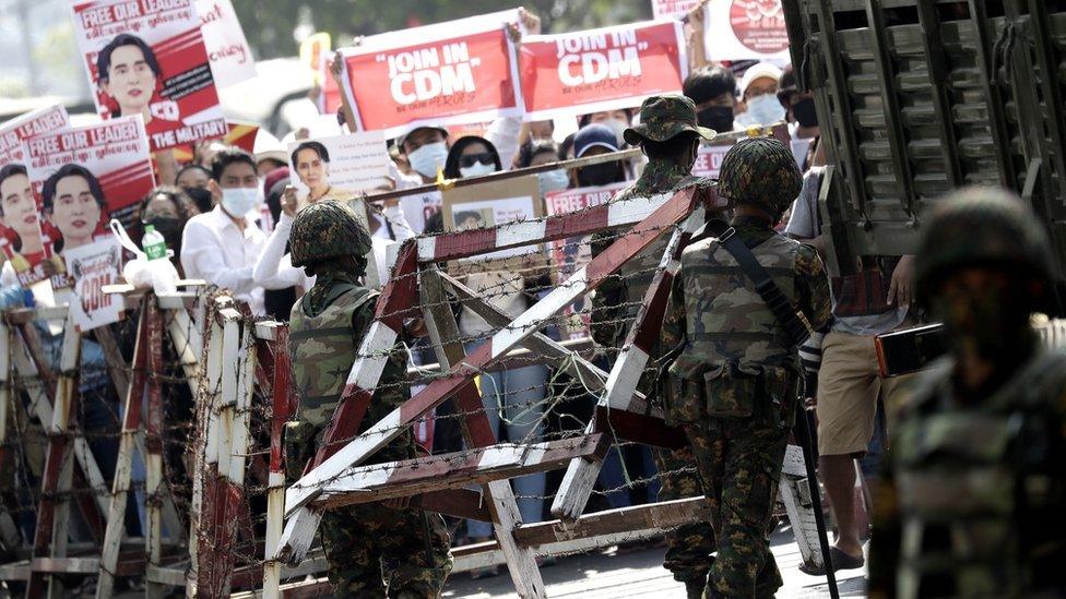 Protesters and military in a Yangon street in 1988