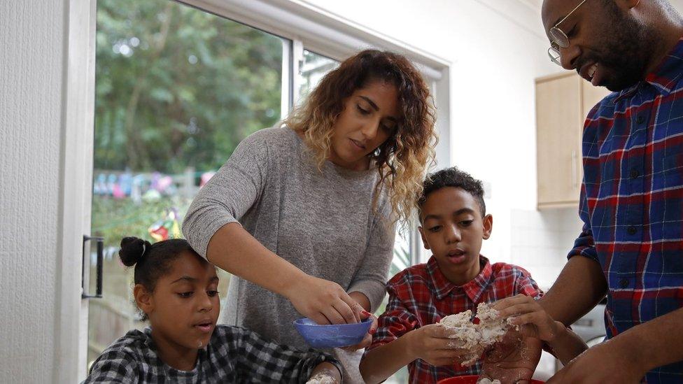 mixed race family cooking