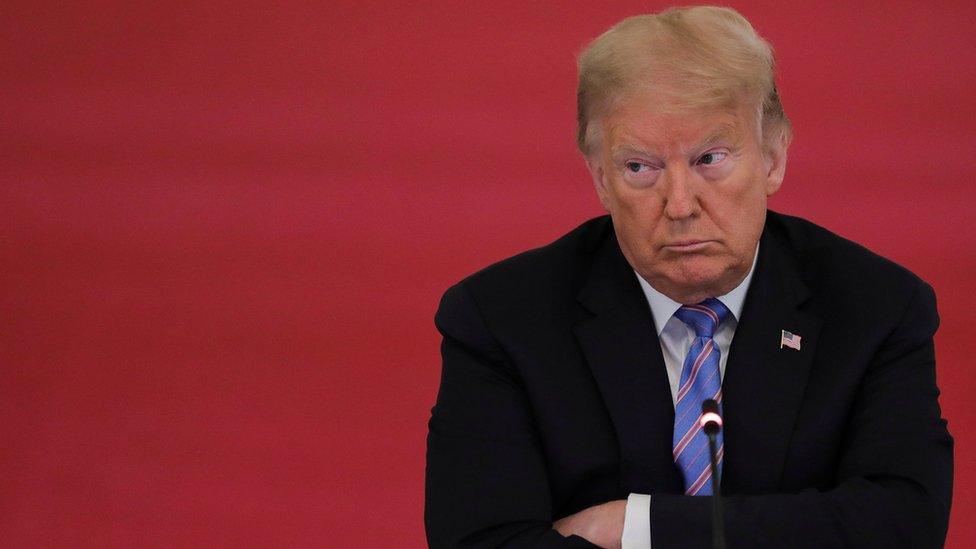 U.S. President Donald Trump listens during a meeting of the American Workforce Policy Advisory Board