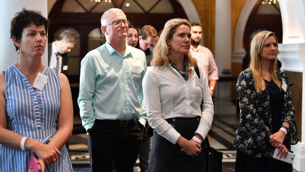 People listen to No campaigner Lyle Shelton speak after the result