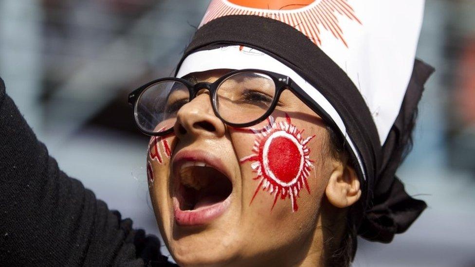 A Nepalese Communist activist takes a part in a rally against the dissolution of parliament in Kathmandu, Nepal