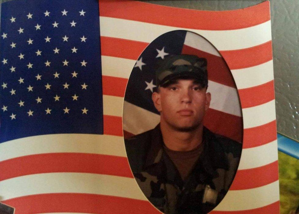 Adam's photo in military uniform, superimposed on the American flag