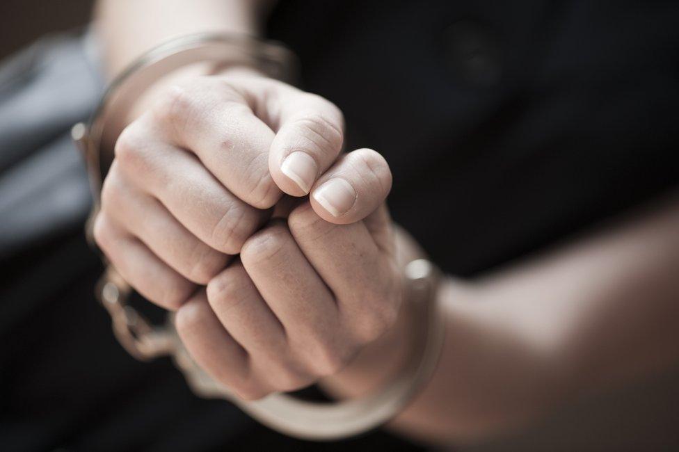 Woman in handcuffs