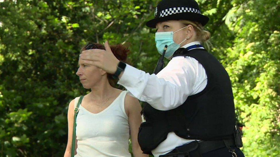 Police officer talking to a woman in Brockwell Park