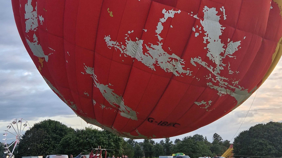 BBC globe balloon lifting off into the sky